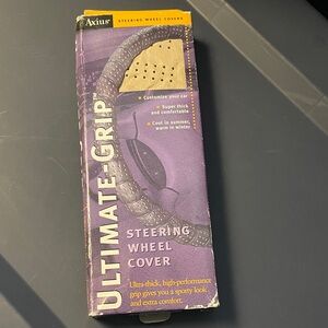 New in box-Axius Ultimate Grip Steering Wheel Cover. Never used